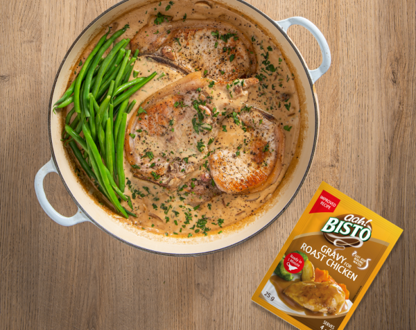 Pork Chops Cooked in Mushroom and Mustard Gravy, served with Spring Vegetables